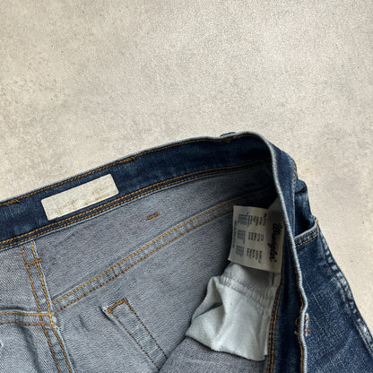 Wrangler koptatott térdű farmernadrág
